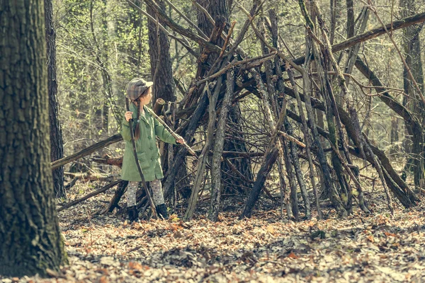 little girl in the wood near  hut