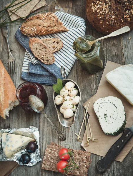 French snacks on a wooden table — Stock Photo, Image