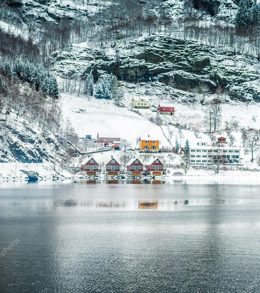  red house on a background of the rocky mountains