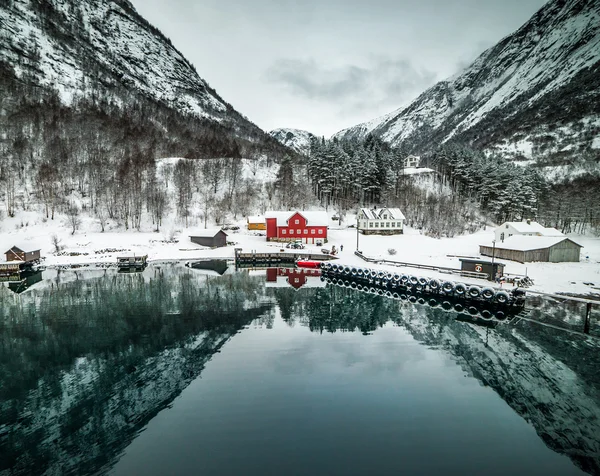 red house on a background of the rocky mountains