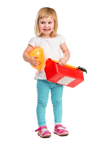 Kleines Mädchen spielt mit Instrumenten — Stockfoto