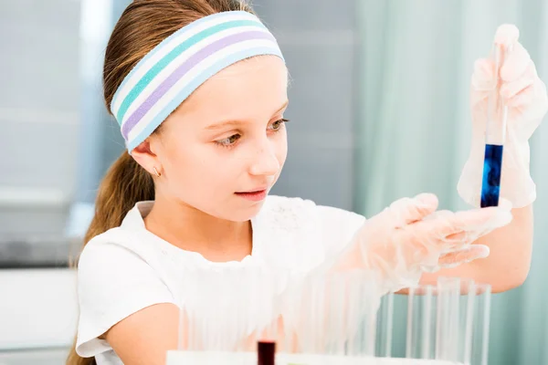 Little girl with flasks for chemistry — Stock Photo, Image