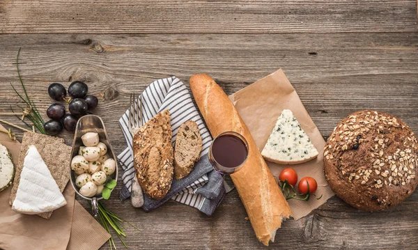 French snacks on a wooden table — Stock Photo, Image