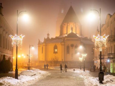 Center Of Gniezno Undergoing Changes As People Walk Down The Snowy Street