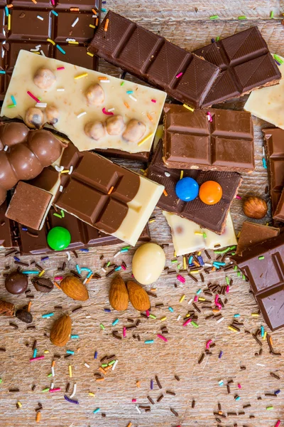 Chocolate and candies on background — Stock Photo, Image