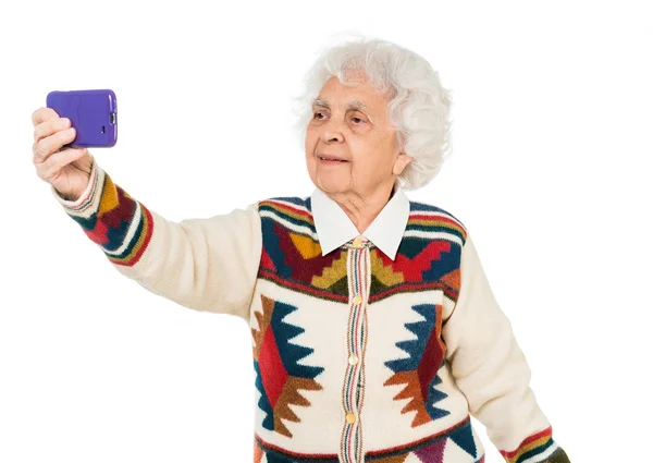 Elderly woman taking selfie — Stock Photo, Image