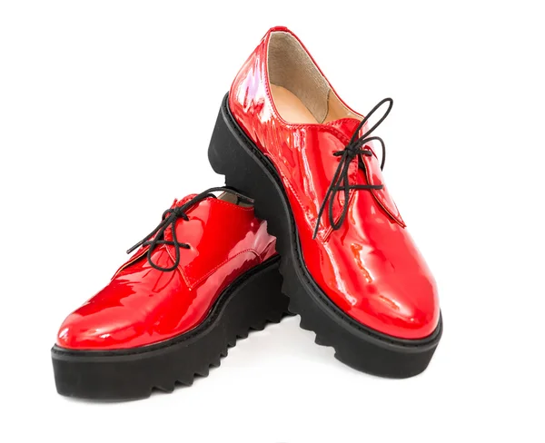 Пара червоних патентних шкіряних чоботів — стокове фото