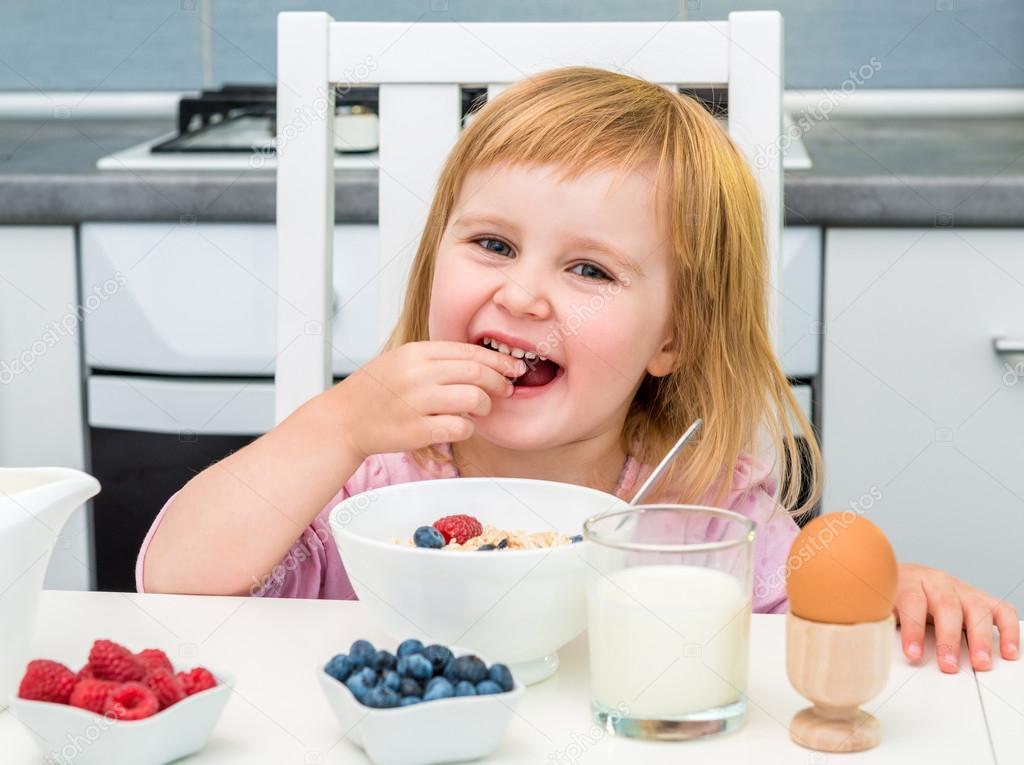 little girl having healthy breakfast