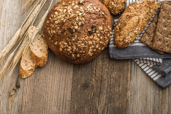 Bread on a wooden background — Stock Photo, Image