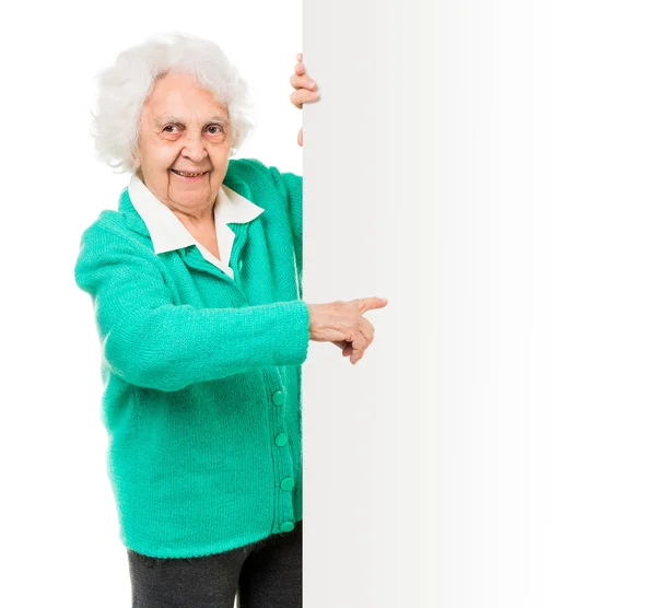 Anciana junto a de tablero de anuncios — Foto de Stock
