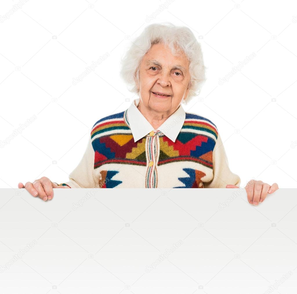 elderly woman behind a board over white background