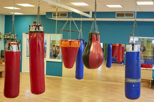 Interior of a spacious gym with punching bags — Stock Photo, Image