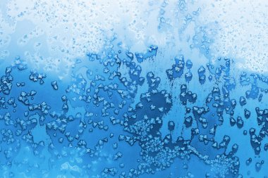 Güzel buz desenli, doğal mevsimlik arka plan yakın plan, kış penceresi dokusu.