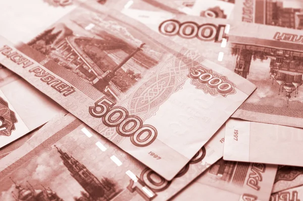 Финансовый фон с российским рублём — стоковое фото