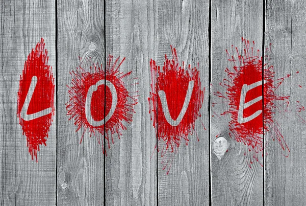 Palavra "Amor" em uma parede de madeira — Fotografia de Stock