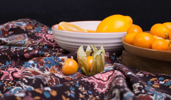 Kumquat, physalis and lemon — Stock Photo, Image