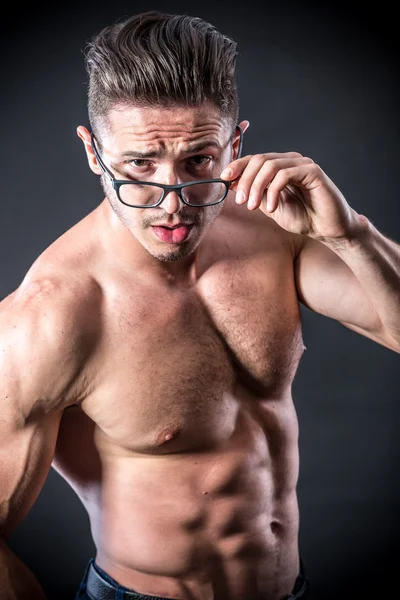 Muscular young man in glasses — Stock Image Muscular young man in glasses Stock Image