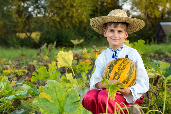 Boy holding pumpkin — Stock Photo, Image