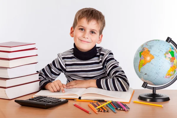 Cute schoolboy writting Stock Image