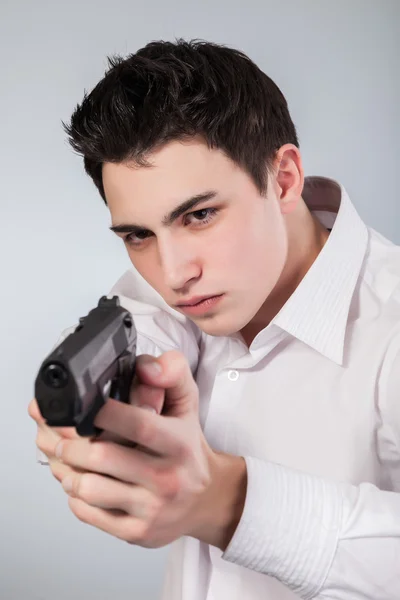 Serious man with gun — Stock Photo, Image