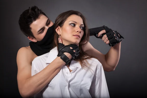Taking woman as hostage — Stock Photo, Image
