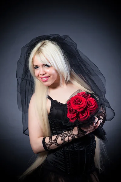 Černá vdova s květinami — Stock fotografie