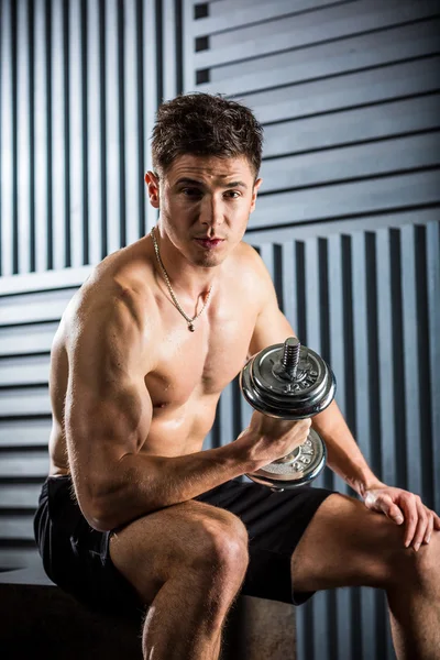 Muscular man with dumbbell — Stock Photo, Image