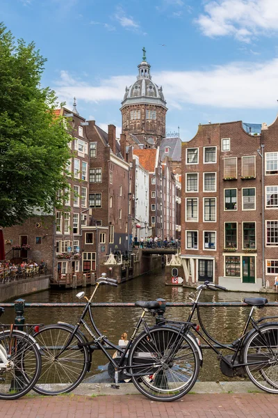 Bicycles on a bridge over canal — Stock Photo, Image