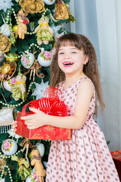 Girl with christmas present — Stock Photo, Image