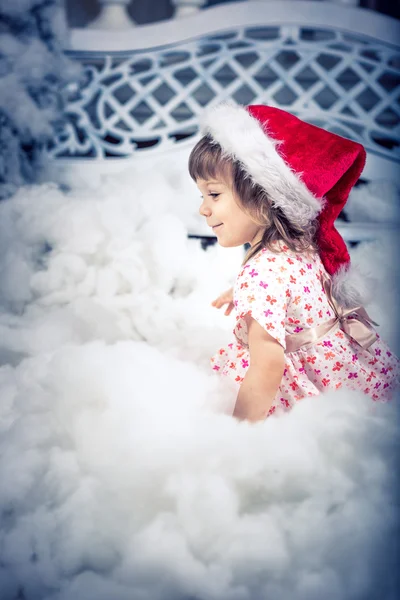 Girl in santa claus hat — Stock Photo, Image