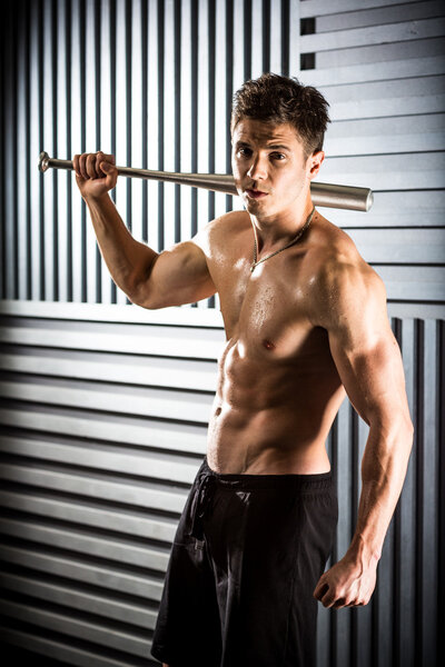 Muscular man  with a bat