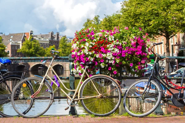 Bicycles on a bridge over canals — Stock Photo, Image