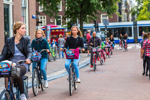 People riding bicycles