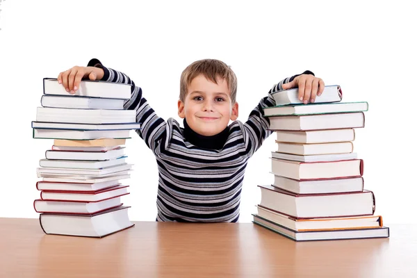 Schoolboy and   heap of books — Stock Photo, Image