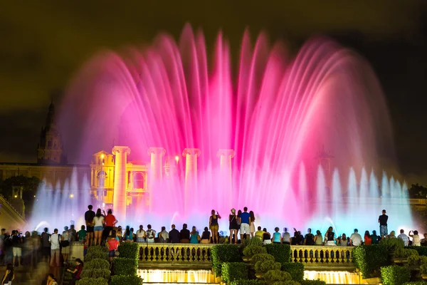 Fountain light show at night in Barcelona — стокове фото