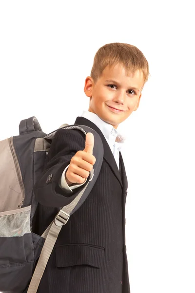 Schoolboy sitting on books — Stock Photo, Image