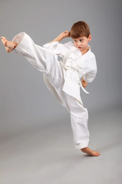 Karate boy in white kimono — Stock Photo, Image