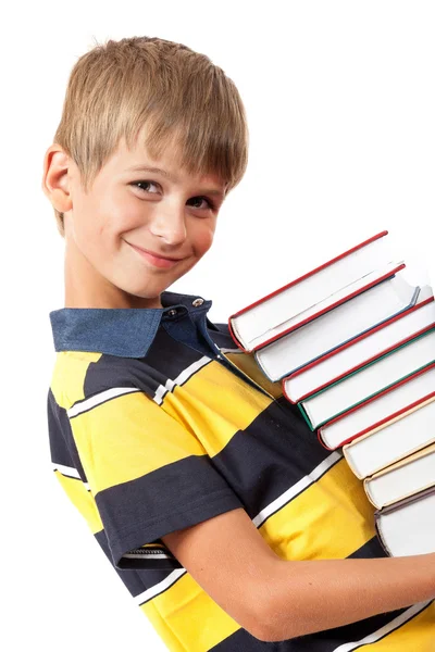 Skola pojke håller böcker — Stockfoto