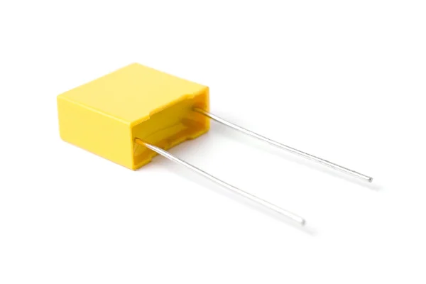 Yellow plastic-film capacitor isolated on white background. — Stock Photo, Image