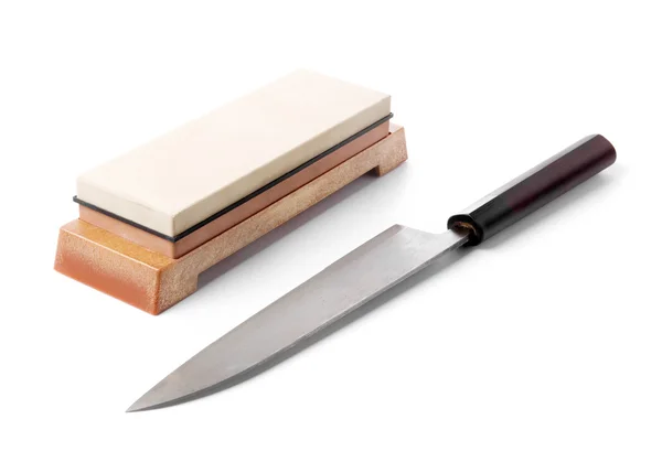 Trditional japanese kitchen knife and water stone. Isolated on w — Stock Photo, Image