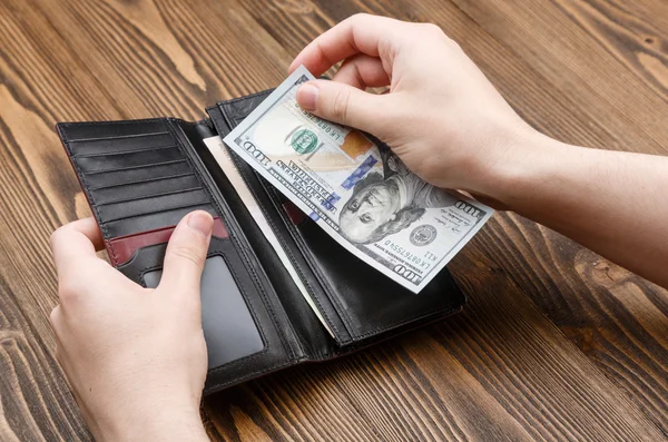 Black man's wallet in man hands — Stock Photo, Image