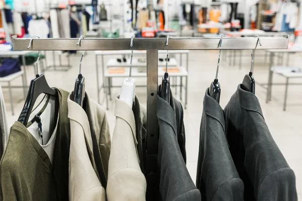 Men's jackets on a hangers — Stock Photo, Image