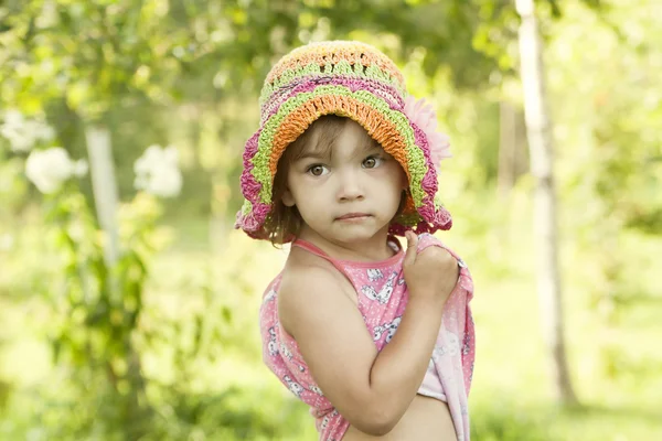 Cute little girl in a summer grove — Stock Photo, Image