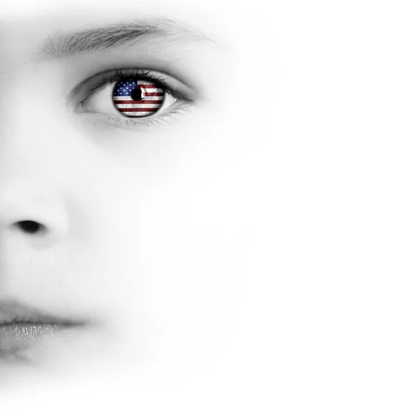 Cara de niño, ojo y bandera americana — Foto de Stock