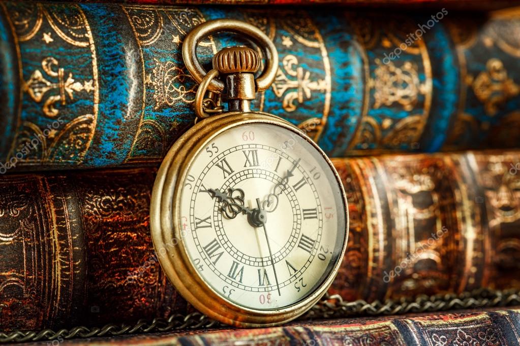 Old Books and Vintage pocket watch Stock Photo by ©cookelma 110216538