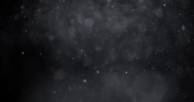 Karanlık arkaplanda soyut parçacık bokeh 'i yüzdürür