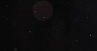 Karanlık arkaplanda soyut parçacık bokeh 'i yüzdürür