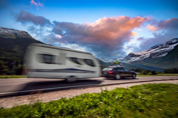 Family vacation travel, holiday trip in motorhome RV, Caravan car Vacation. Beautiful Nature Italy natural landscape Alps. Warning - authentic shooting there is a motion blur.