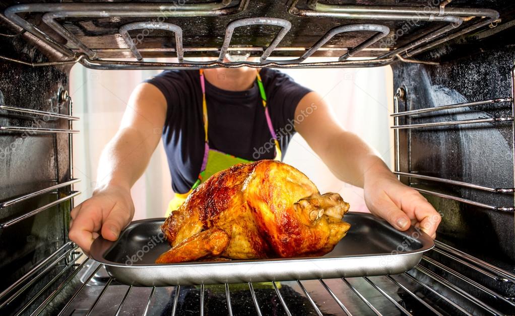 Cooking chicken in the oven at home. Stock Photo by ©cookelma 54217295