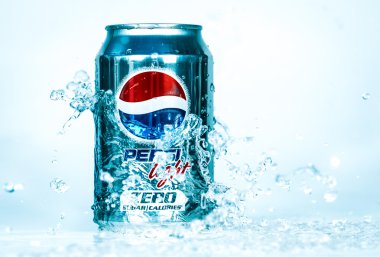 Can of Pepsi cola Lignt in water. clipart